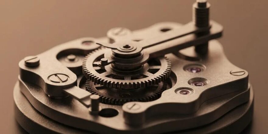 Beginner investor studying online investment courses with books and a laptop in a cozy workspace