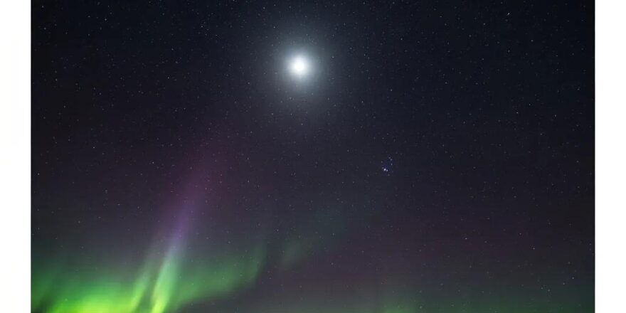 Group of real estate investors discussing investment loan options in a modern office